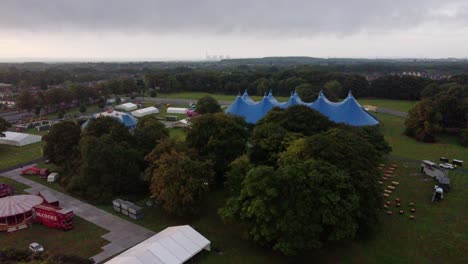 Aerial-Shot-Of-Lorries-Unloading-And-Taking-Equipment-Away-From-The-Music-Festival