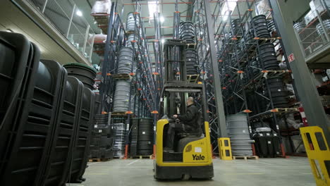 Fork-Lift-Operator-Working-In-A-Commercial-Plastic-Manufacturing-Warehouse