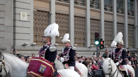 Panning-shot,-horse-riding-guard-opening-the-Good-Friday-religious-procession-during-the-Holy-Week-celebrations-in-Madrid,-Spain