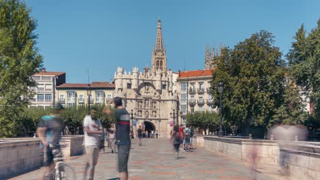 Burgos-Bridge-and-arch-of-santa-maria-timelapse-during-summer-morning-with-blue-sky