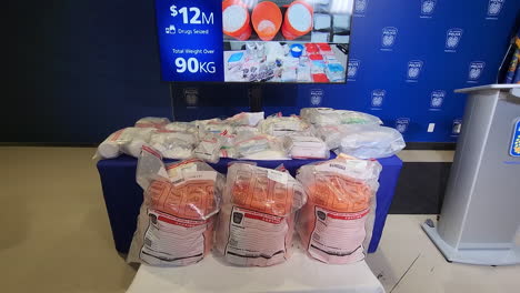 Canadian-police-methamphetamine-and-fentanyl-illegal-drug-encounter-white-powder-in-bags-on-a-counter