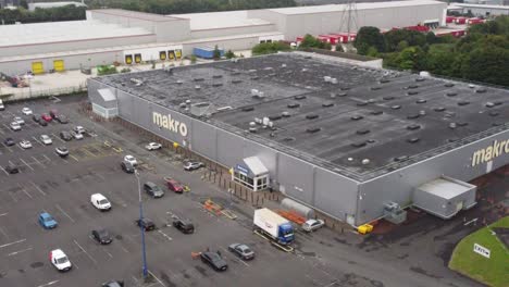Aerial-rising-view-makro-cash-and-carry-wholesale-supermarket-store-exterior