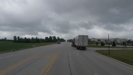 POV-shot-driving-close-next-to-a-truck-that-has-stopped-in-the-middle-of-the-road