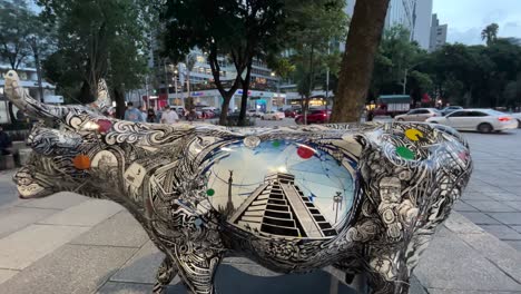 shot-of-street-art-with-cows-painted-on-the-street-representing-the-pyramids