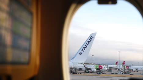 Wing-With-Ryanair-Logo-Of-The-Aircraft-View-From-Airplane-Window-Seat-During-Take-Off-In-Lisbon-Airport---POV