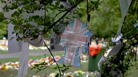 Queen-Shaped-Drawing-Of-Union-Jack-Hanging-From-Tree-In-Green-Park-Following-Death-Of-Queen-Elizabeth-II