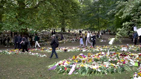 People-Visiting-Green-To-See-The-Floral-Tributes-For-Queen-Elizabeth-II-On-12-September-2022