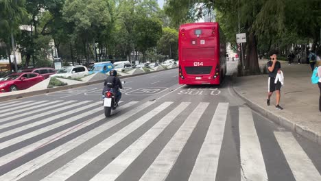 slow-motion-shot-of-public-transport-in-mexico-city-circulating-along-the-paseo-de-la-reforma-during-the-afternoon