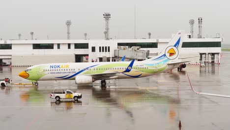 Nok-Air's-Boeing-737-is-being-pushed-back-and-started-up-at-Donmuang-Airport,-Bangkok,-Thailand