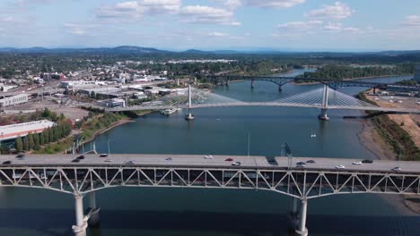 Sideway-panning-drone-shot-of-downtown-Portland-Oregon-bridges-on-a-nice-sunny-afternoon