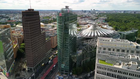 Dramatic-aerial-view-flight-static-tripod-drone
of-2-Towers-skyscraper-Potsdamer-Platz-in-Berlin-Germany-at-summer-day-2022