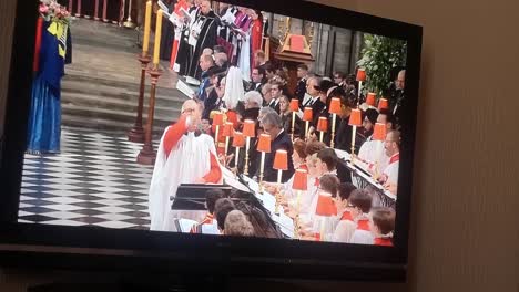 Household-watching-Her-Majesty-Queen-Elizabeth-ceremonial-funeral-broadcast-on-British-television-at-home