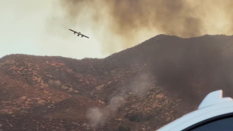 Tracking-Shot-Air-Attack-140-OV-10-Bronco-Plane-Descending-and-Turning-Left-Bypassing-the-Black-Smoke-From-Fire