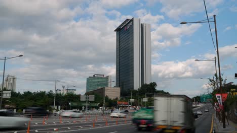 Seoul-busy-traffic-on-Yangjae-daero-road-and-clouds-over-LG-Electronics-Seocho-Research-and-Development-Campus-Building-daytime