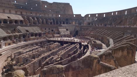View-of-the-Colosseum-arena-interior,-hypogeum-filled-with-walls,-raked-areas-that-once-held-seating