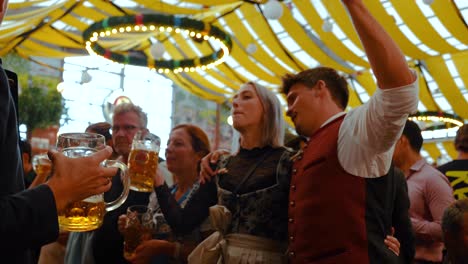 People-party-in-beer-tent-at-Oktoberfest-Munich