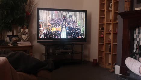 Family-watching-Queen-Elizabeth-ceremonial-funeral-service-broadcast-on-British-television-at-home