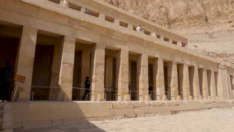 People-visiting-ruins-of-The-mortuary-temple-of-Hatshepsut,-opposite-Luxor-city,-Egypt
