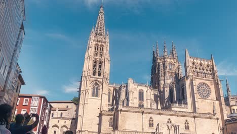 Hyperlapse-pov-walking-in-Burgos-Santa-Maria-Bridge,-arch-and-Cathedral-on-a-sunny-blue-sky-summer-day