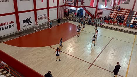 Fixed-Shot-Of-Young-Girls-Team-Playing-Handball-Match-In-Beautiful-Court-,-Paraguay