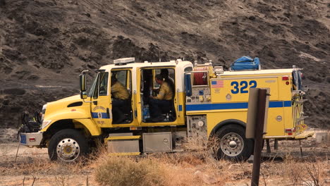 Cal-Fire-Department-Firefighters-Crew-Resting-in-Firetruck-After-Battle-With-Fairview-Wildfire,-California-USA