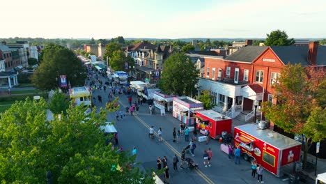 People-enjoy-food-stand-vendors-at-street-fair-in-USA