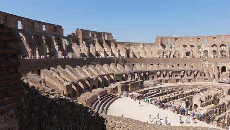 Visitors-at-the-Colosseum,-Rome,-Italy,-on-a-sunny-bright-day