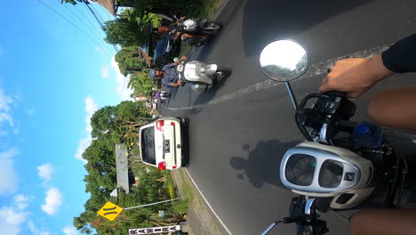 Riding-motorbike-in-busy-streets-of-Bali,-POV-vertical-video