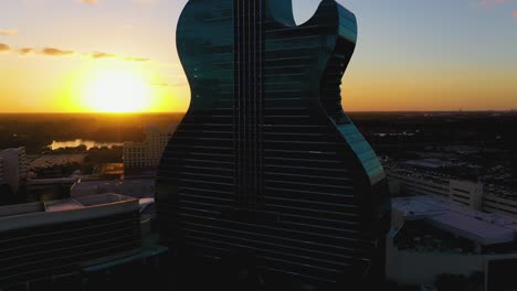 Aerial-view-in-front-of-the-Seminole-Hard-Rock-Hotel-and-Casino-Hollywood,-sunset-in-Florida,-USA---ascending,-drone-shot