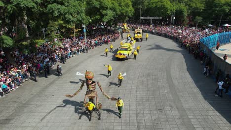 Aerial-view-of-a-skeleton-and-a-decorated-trucks,-Dia-de-Muertos-Parade,-on-Reforma-avenue-in-Mexico-city