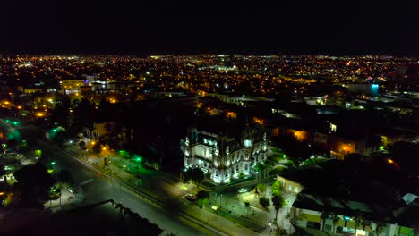 Aerial-view-around-the-Centro-Cultural-Universitario-Quinta-Gameros-building-in-Chihuahua,-quiet-evening-in-Mexico---orbit,-drone-shot