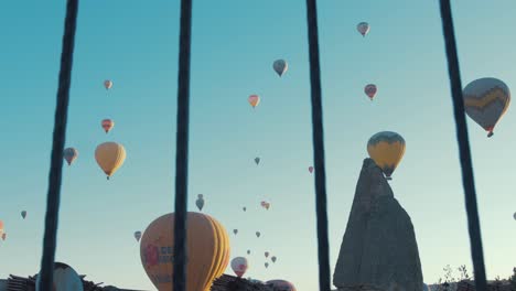 Hot-Air-Balloons-Cappadocia-sky-Shot-pushing-through-railings