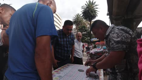 Fast-Sleight-of-Hand-Street-Bet-Trick-by-a-Scammer-in-Medellin-Colombia-Hustler-at-Comuna-13-Gambling-Fortune