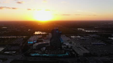 Aerial-view-overlooking-the-Hard-Rock-Hotel,-sunset-in-Hollywood,-Florida,-USA---orbit,-drone-shot