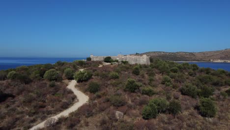 Drone-shot-of-a-former-Ottoman-castle---drone-is-ascending-and-revealing-the-ocean-in-the-back