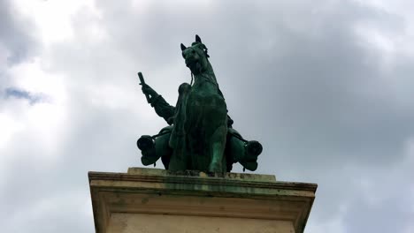 Front-View-Of-The-Equestrian-Statue-Of-King-Louis-XIV-In-Paris,-France---tilt-up