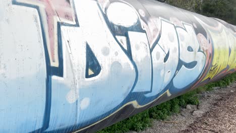 A-large-gas-pipe-line-with-spray-paint-graffiti-vandalism