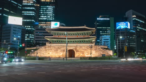 View-of-Namdaemun-gate-with-night-cars-traffic---zoom-out-time-lapse