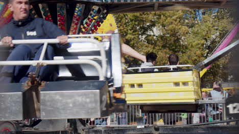 Slowmotion-shot-of-kids-spinning-around-on-a-carnival-ride