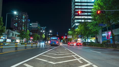 Seoul-Night-Timelapse-of-cars-and-buses-traveling-along-a-wide-multilane-road-in-Yongsan-gu-district-with-a-view-of-Namsan-tower---static