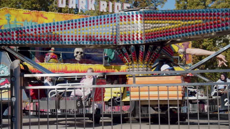 Slowmotion-shot-of-a-carnival-ride-spinning-while-children-enjoy-themself