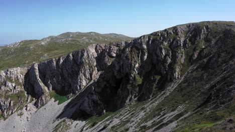 Cinematic-drone-shot-of-the-steep-cliffs-in-the-mountains-of-Galičica-National-Park-on-a-beautiful-sunny-day