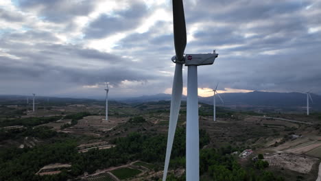 Detailed-close-up-view-of-inoperative-wind-turbines-blades-rotating-at-Coll-de-Moro-in-Catalonia,-Spain