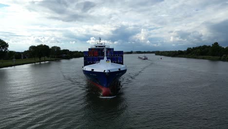 Aerial-View-Off-Forward-Bow-Of-BG-Onyx-Cargo-Container-Ship-Approaching-Along-Oude-Maas-Through-Zwijndrecht