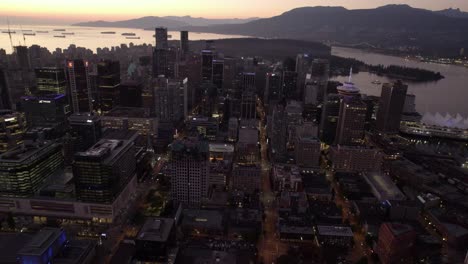 Central-Vancouver-skyline-and-the-Waterfront,-sunset-in-BC,-Canada---Aerial-view