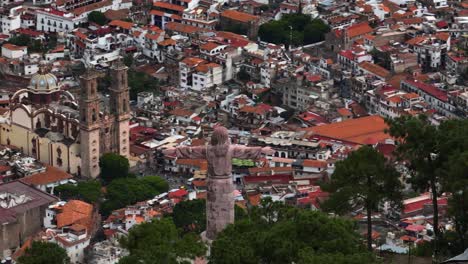 Aerial-view-around-the-Christ-cross-monument-with-Taxco-Guerrero-town-in-the-background