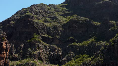Steep-volcanic-rock-cliff-on-mountain-at-Masca-Gorge,-aerial