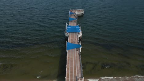 Pier-and-Aerial-View,-Pompano-Beach-FL-USA-Cityscape-Skyline,-Beachfront-Buildings,-Canal-and-Ocean-Horizon,-Drone-Shot