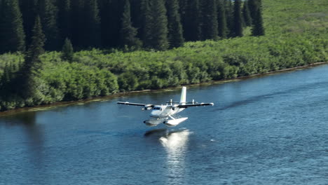 Incredible-tracking-shot-following-a-seaplane-landing-on-a-river-in-Labrador,-Canada