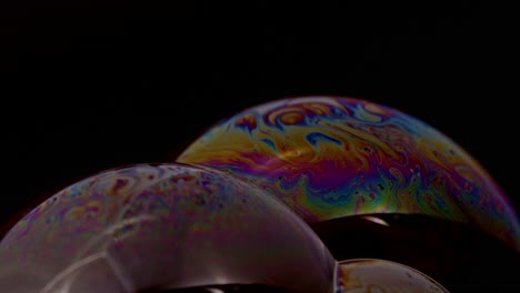 Closeup-of-two-rainbow-colored-bubbles-and-animation-for-example-for-backgrounds